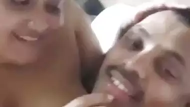 Chubby wife soft boobs pressed against husband in foreplay