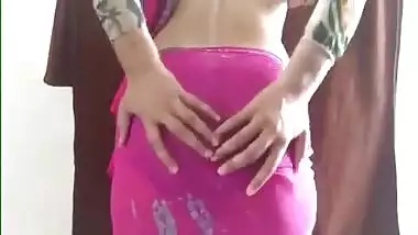 Defenseless Indian girl in a pink sari airs her sex melons in XXX video
