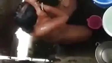 Desi girl takes shower without knowing that a voyeur films her
