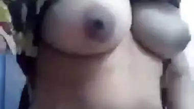 Desi fatty poses for the camera to reveal her big XXX boobs and slit