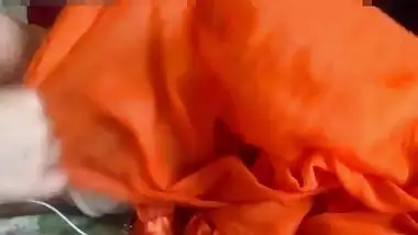 Indian MILF rubs her boobs and creams them lying in the bed in porn clip